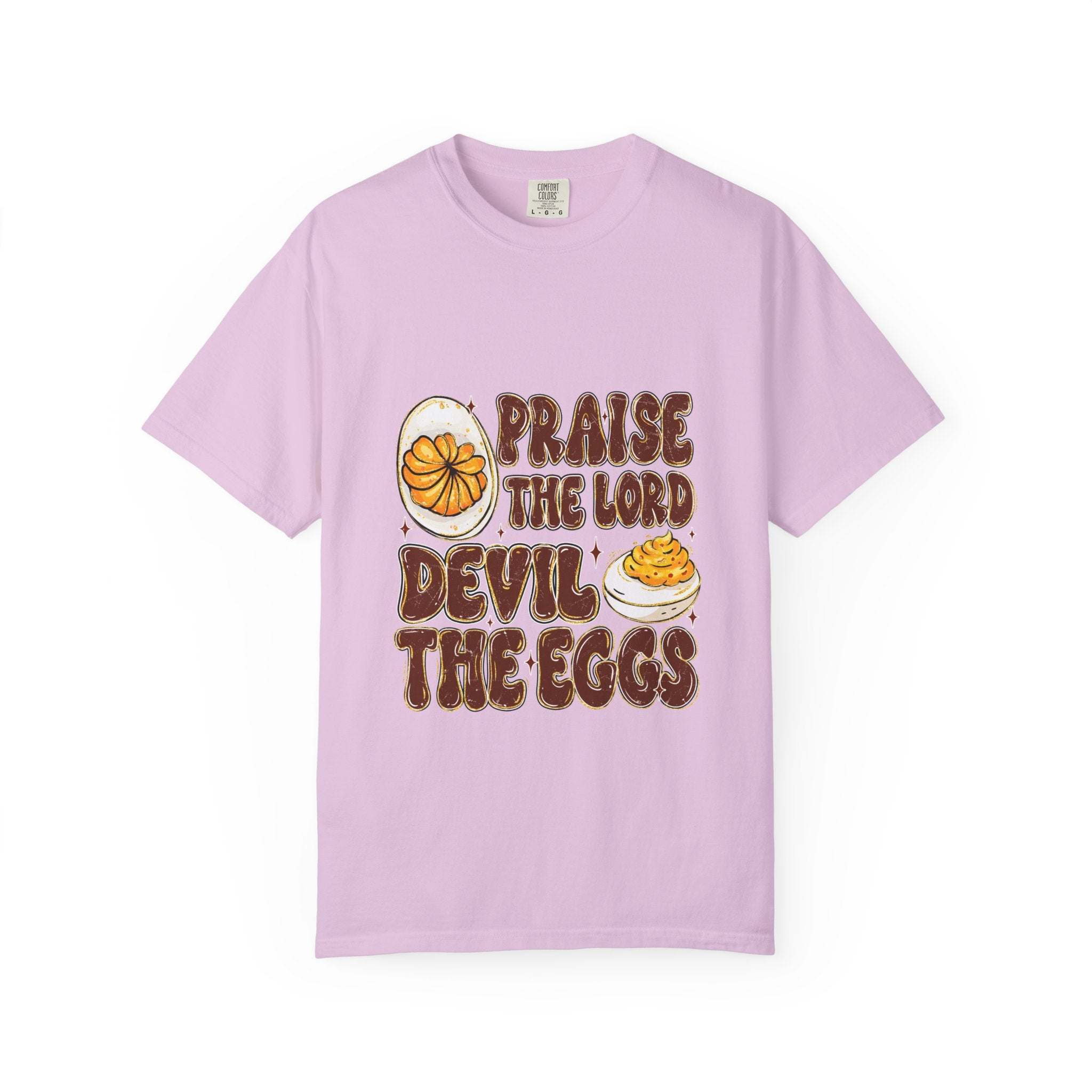 White cotton t-shirt featuring 'Praise the Lord, Devil the Eggs' design, perfect for Easter and Christian apparel.
