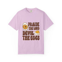 White cotton t-shirt featuring 'Praise the Lord, Devil the Eggs' design, perfect for Easter and Christian apparel.
