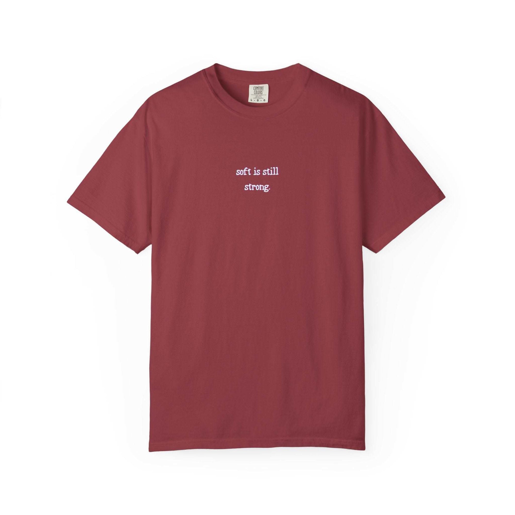 Maroon t-shirt with white text on a white background