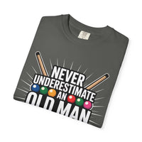 Never Underestimate An Old Man pool cue billiards themed t-shirt folded on grey background