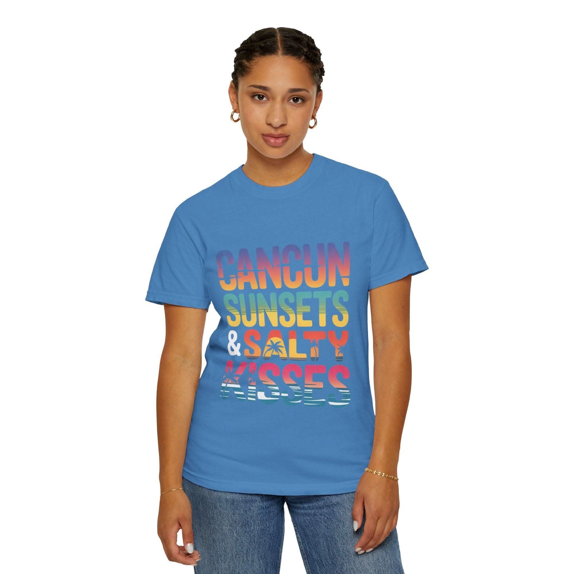 Person wearing a blue t-shirt with colorful text on a white background