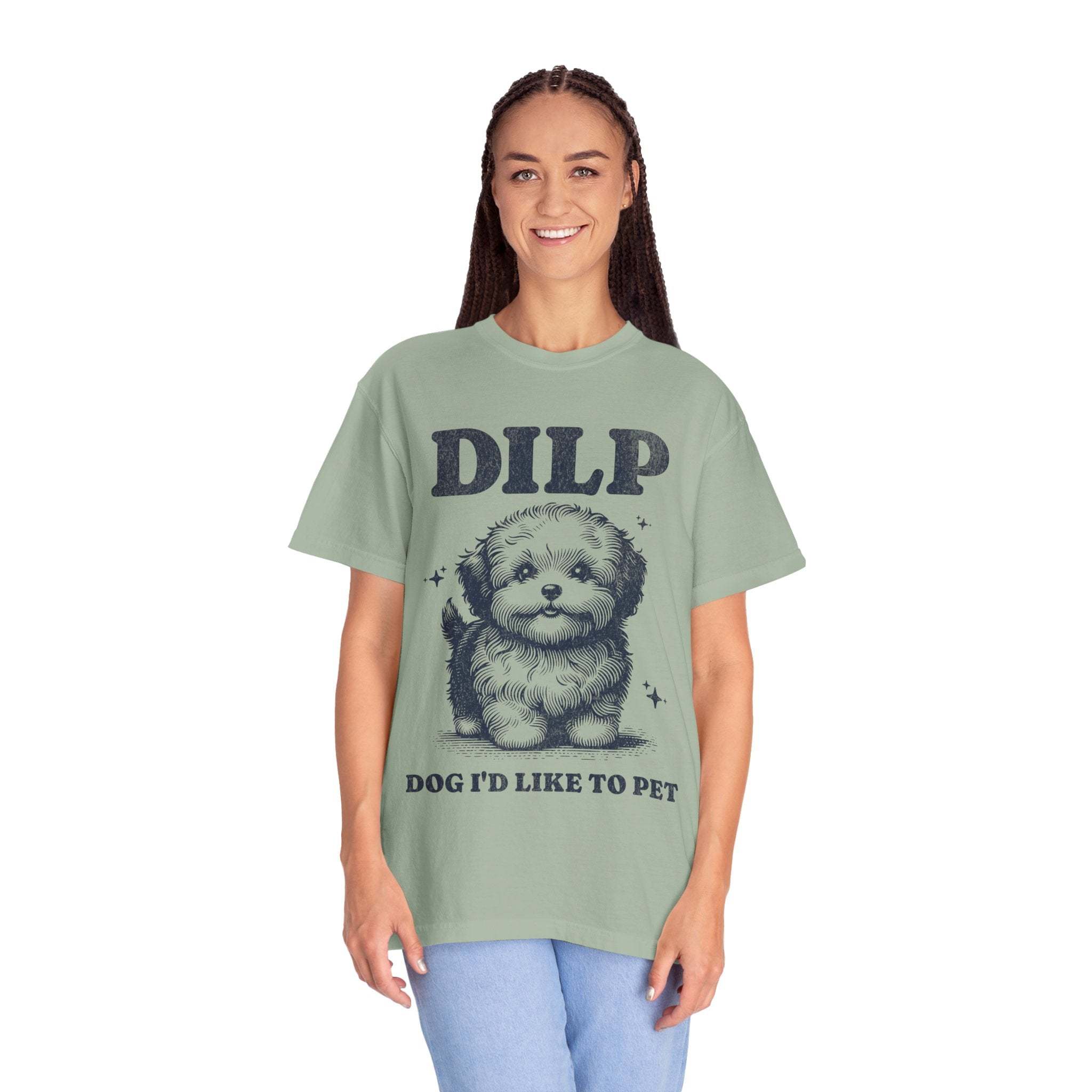 Garment-dyed T-shirt with playful DILP dog graphic and "Dog I'd Like To Pet" text worn by smiling woman