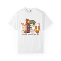 White NICU nurse Halloween T-shirt with patchwork lettering, a sleeping baby in a pumpkin hat, ghosts, and jack-o’-lanterns.