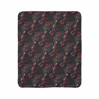 Gothic fleece sherpa blanket with black roses and dagger pattern in dark colors