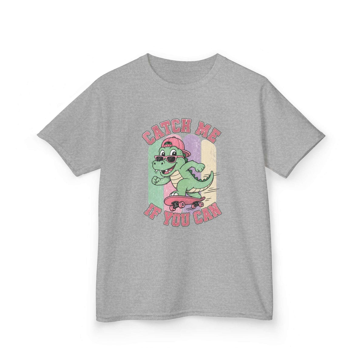 A heather gray short-sleeve t-shirt with a colorful graphic of a cartoon green dinosaur riding a pink skateboard, with the text 'CATCH ME IF YOU CAN' in pink.