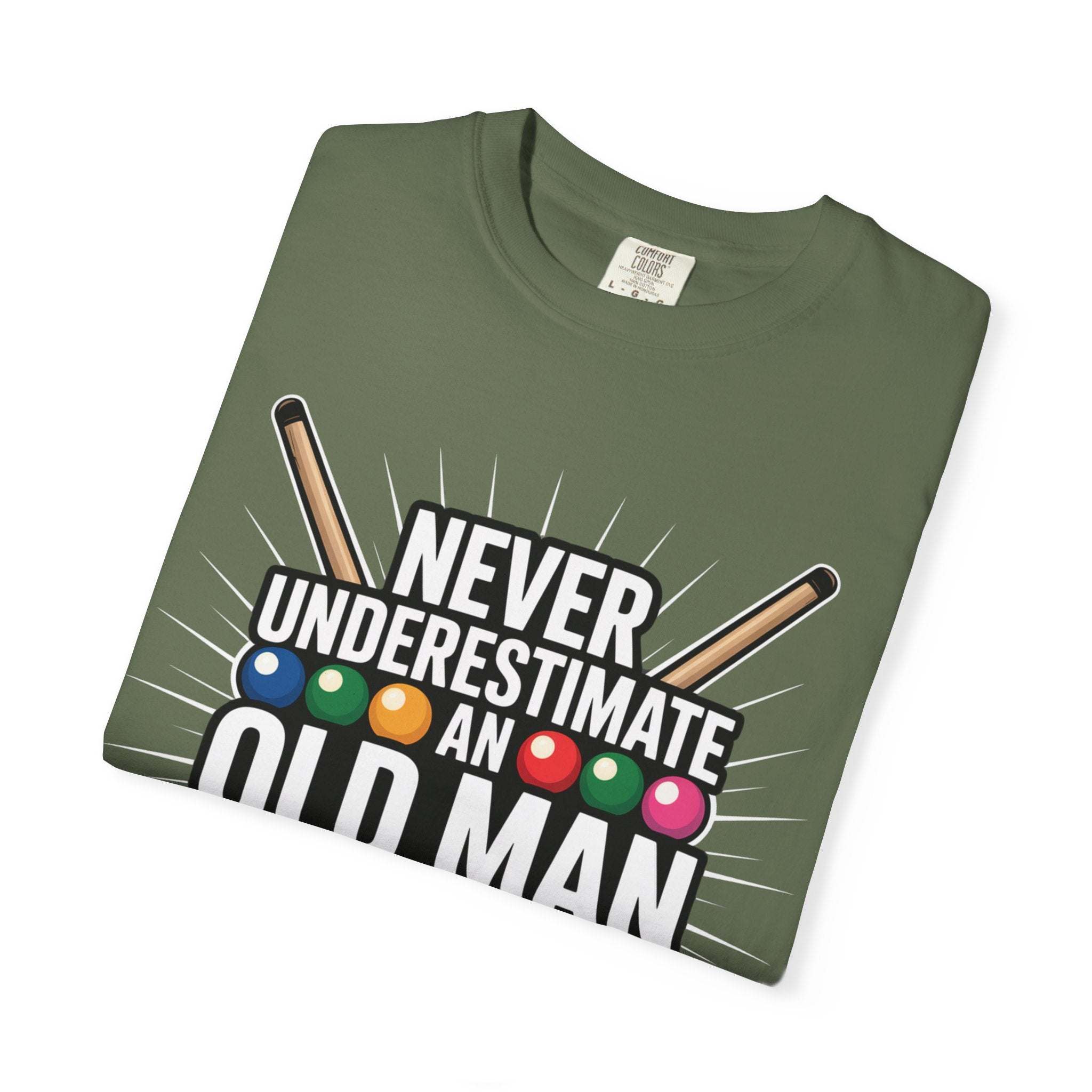 Never Underestimate An Old Man with Pool Cue T-Shirt folded green cotton tee with billiard balls and cue sticks design