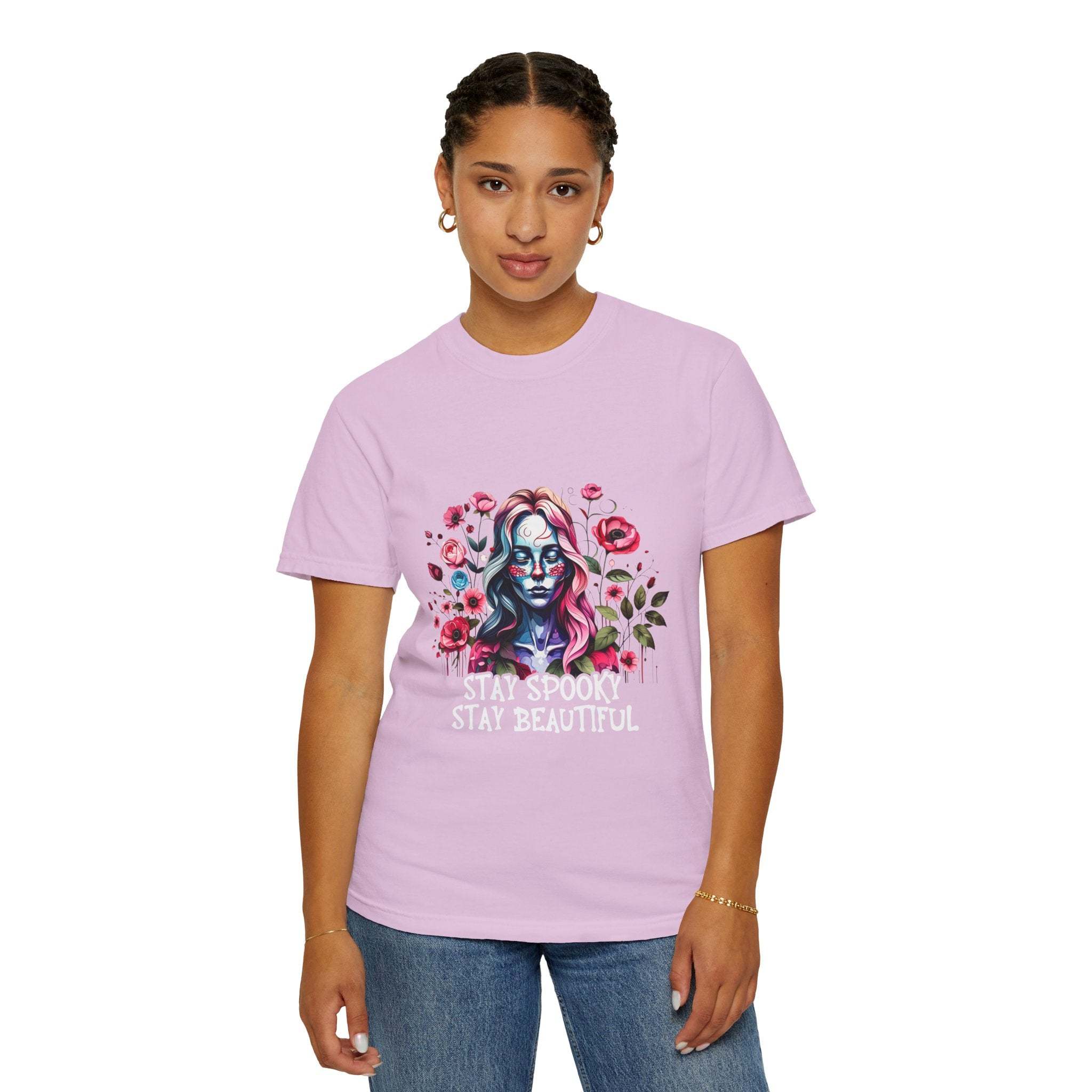 woman wearing pink floral skeleton t-shirt with Stay Spooky Stay Beautiful text