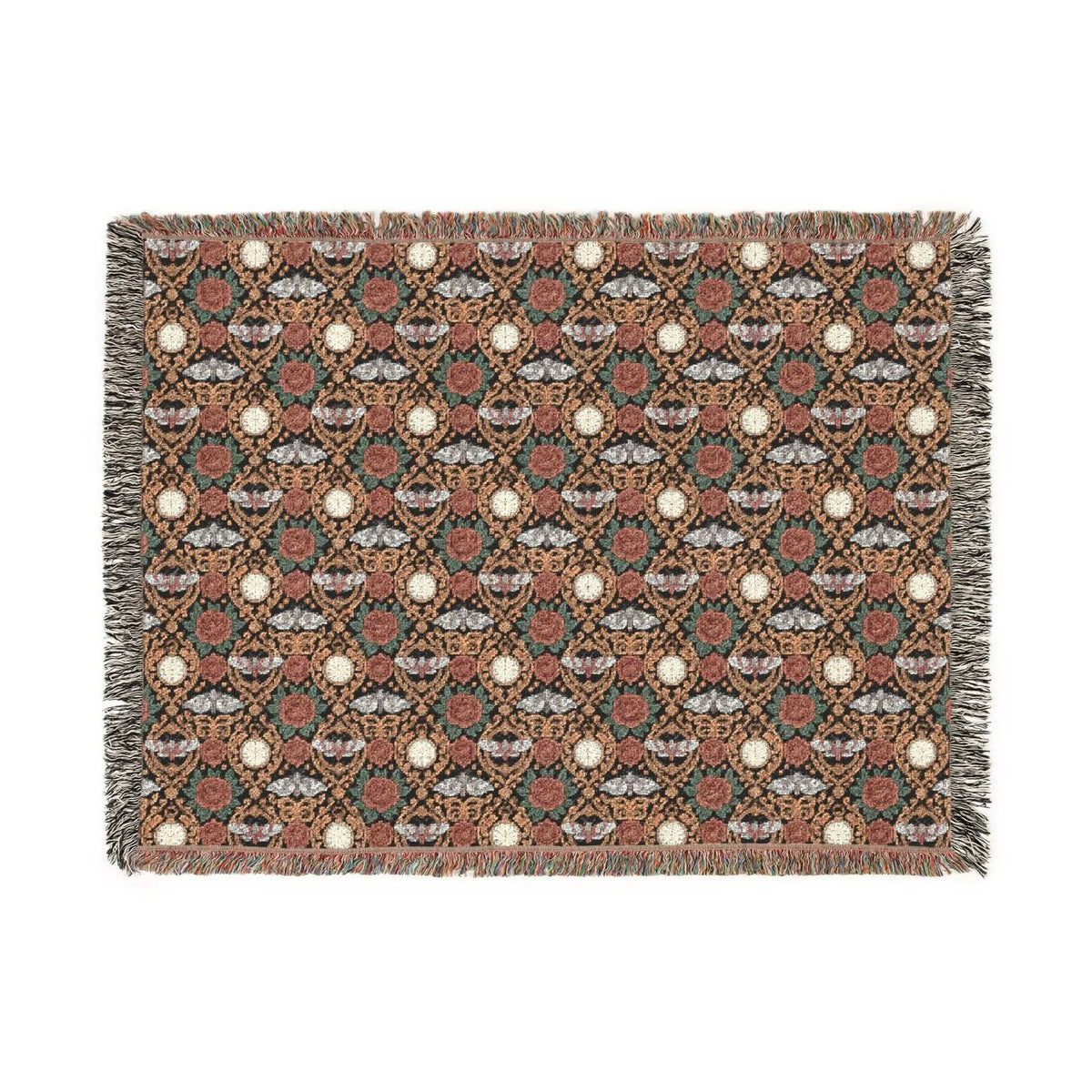 Victorian Gothmas Woven Blanket with candlelight colors and colorful fringed edges draped on a dark velvet bed