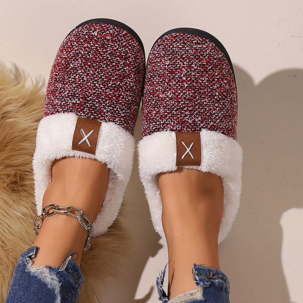 Winter plush slippers with cartoon design and round toe in burgundy and black colors