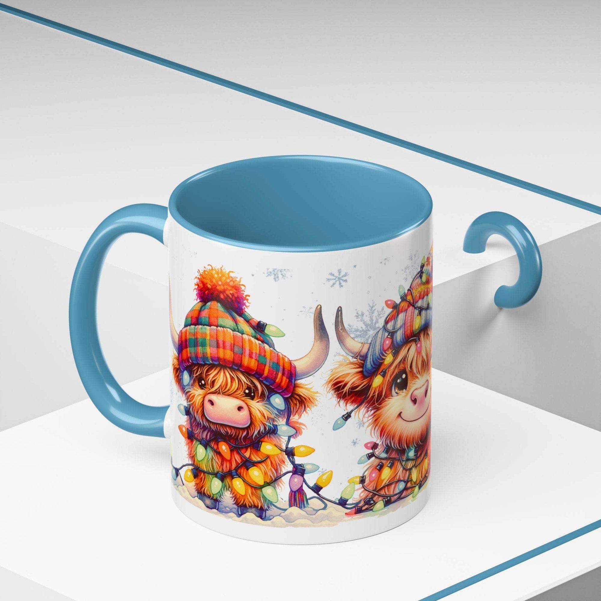 Scottish Highland Cow Christmas coffee mug with colorful holiday hat and lights, blue handle and interior ceramic cup
