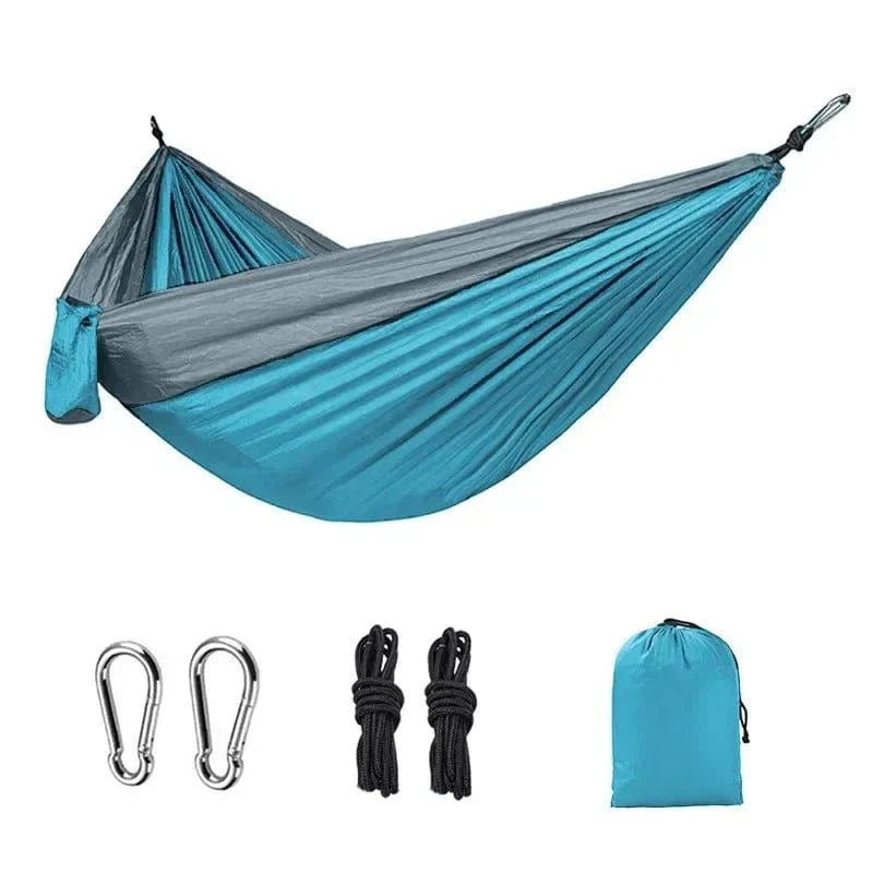 Portable single person camping hammock made of high-strength nylon parachute fabric with color matching design, includes carabiners, ropes, and storage bag.