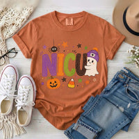 Yam orange NICU nurse Halloween T-shirt with colorful crayon-style lettering, a smiling ghost in a purple beanie, pumpkin, and candy corn.