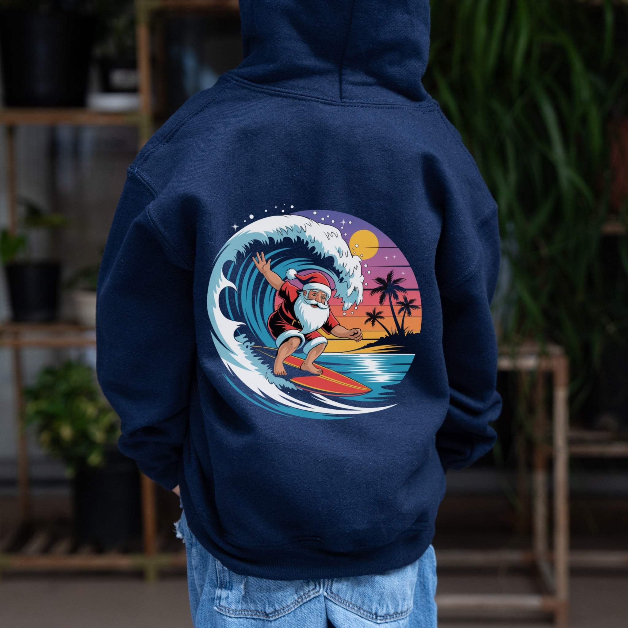 Navy Surfing Santa Hoodie with festive Santa surfing wave graphic for kids winter holidays