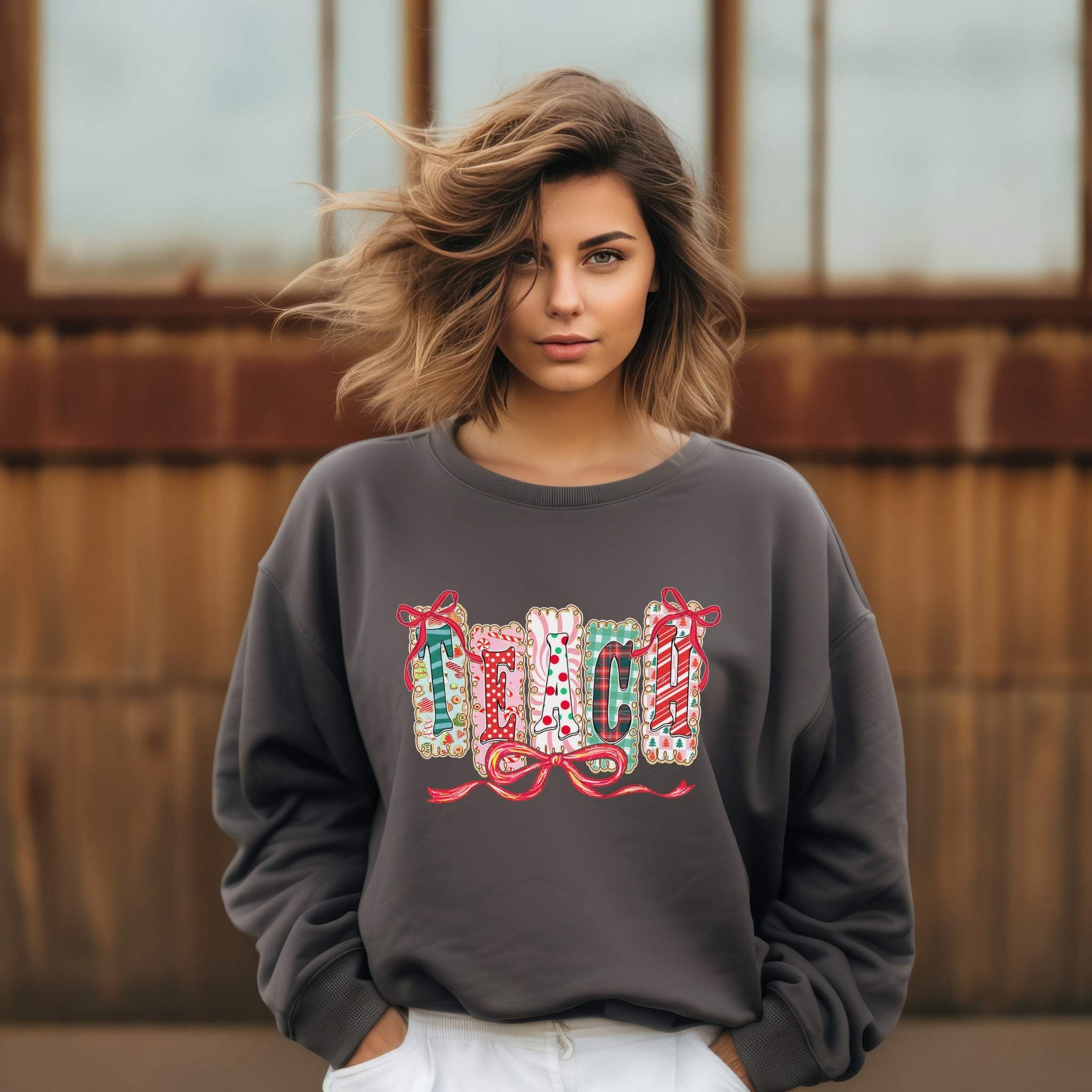 woman wearing gray Sweatshirt Preppy Teach Christmas with festive design outdoors