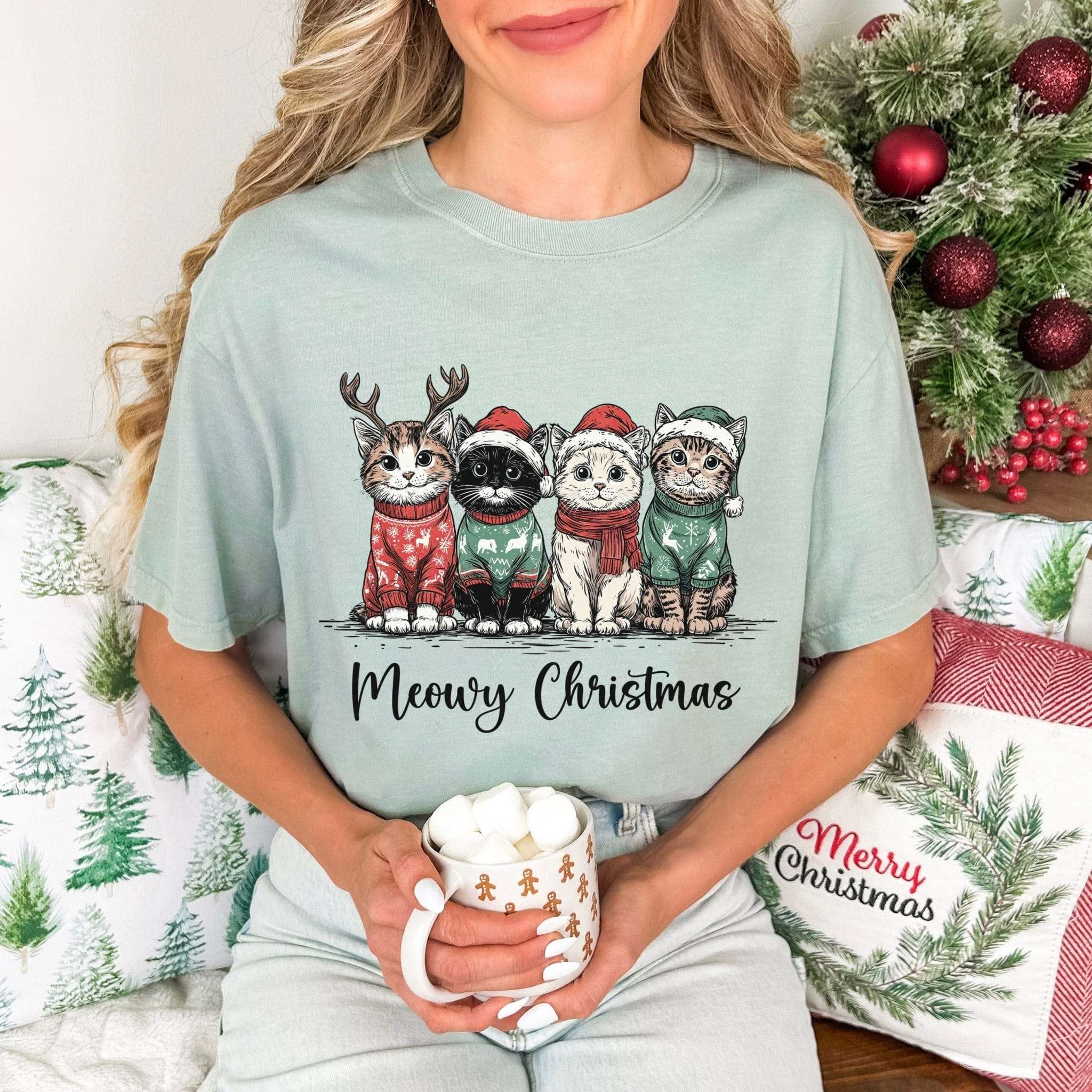 Cat Lover T-shirt with Meowy Christmas cats in holiday sweaters holding a festive mug