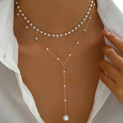 Pearl double layer twin pearl necklace with gold alloy chain and geometric design worn with white shirt