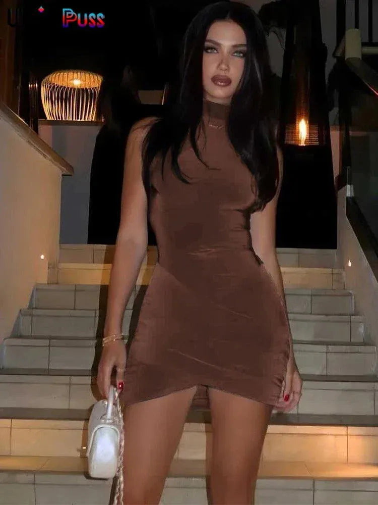 Female model wearing nibber Cross Ruffles Mini Dress with cross-front design and ruffles in soft fabric