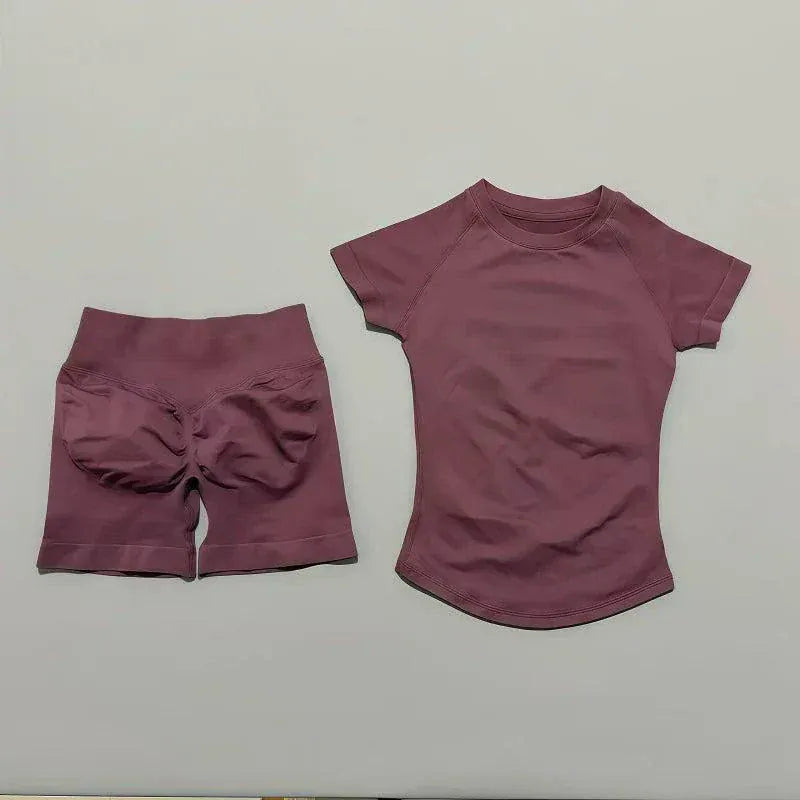 Woman wearing seamless Impact Sports Sets yoga top and workout shorts in a gym setting