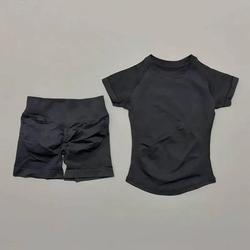 Women wearing Impact Sports Sets seamless yoga top and workout shorts in coordinated athletic outfits