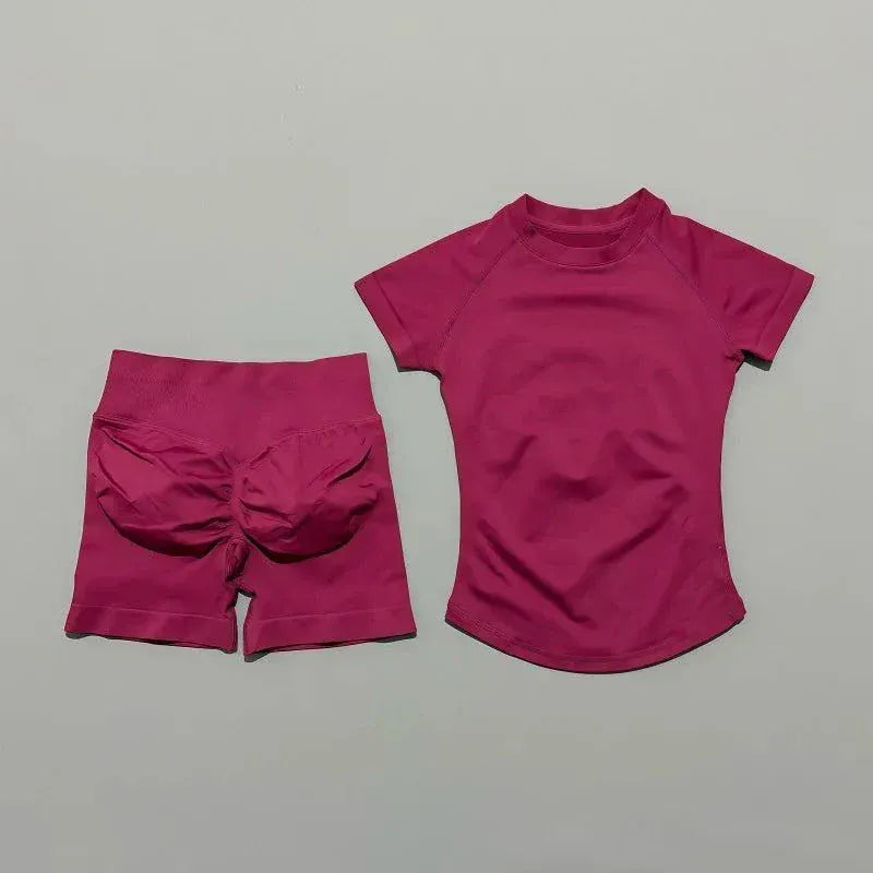 Woman wearing seamless Impact Sports Sets yoga top and high-waisted workout shorts in athletic pose