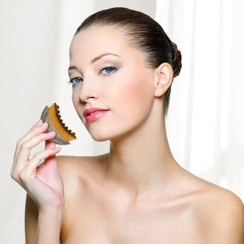 Portable dry facial brush with soft bristles for gentle exfoliation and lymphatic massage