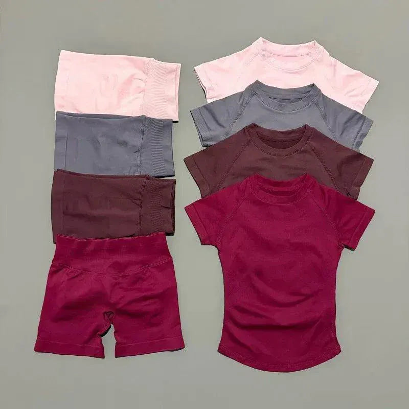 Women wearing seamless Impact Sports Sets with yoga tops and workout shorts for fitness activities