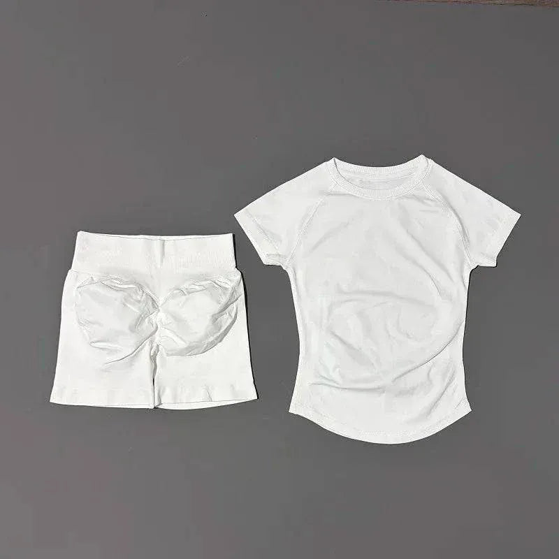 Woman wearing Impact Sports Sets seamless yoga top and workout shorts for active workouts