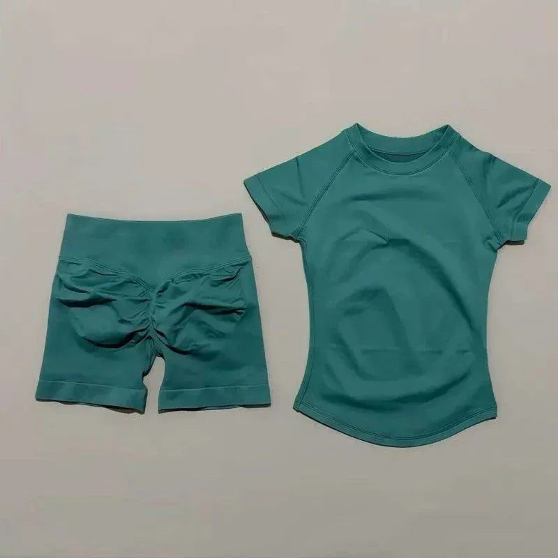 Woman wearing seamless Impact Sports Sets yoga top and workout shorts in coordinated fitness outfit