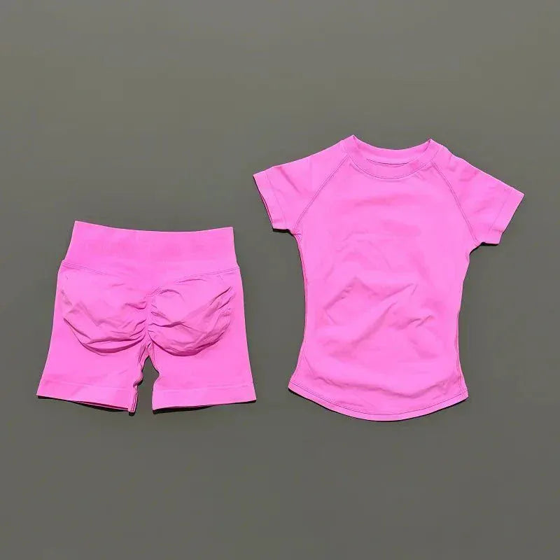 Women wearing Impact Sports Sets seamless yoga top and workout shorts for active fitness sessions