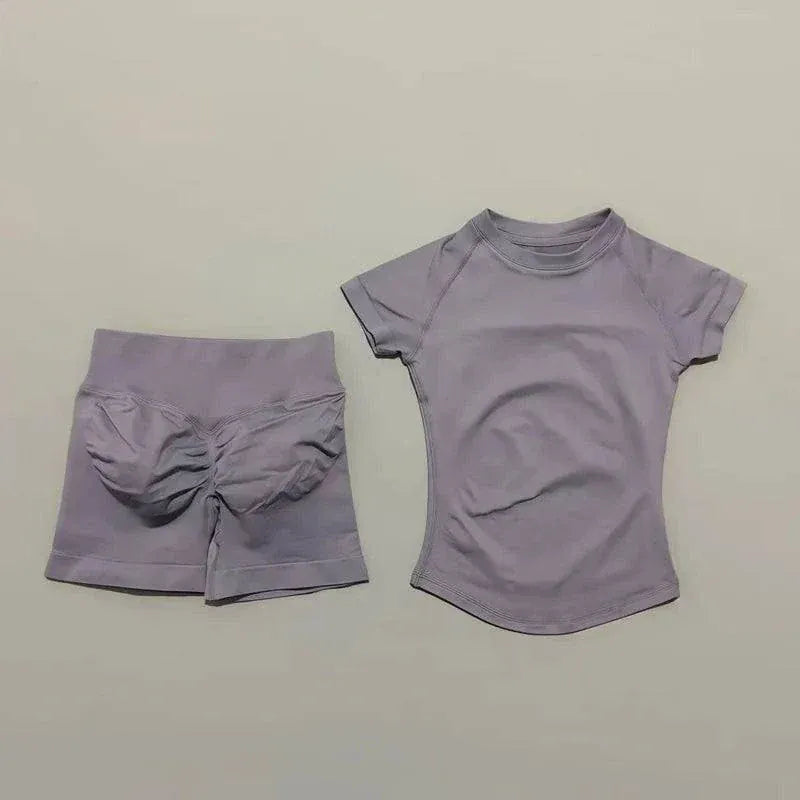 Women wearing Impact Sports Sets seamless yoga top and workout shorts in coordinated athletic style