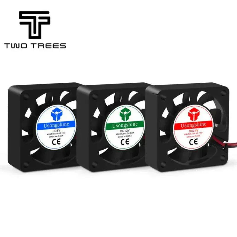 Close-up of a 3D printer cooling fan with black blades and mounting frame designed for efficient filament cooling