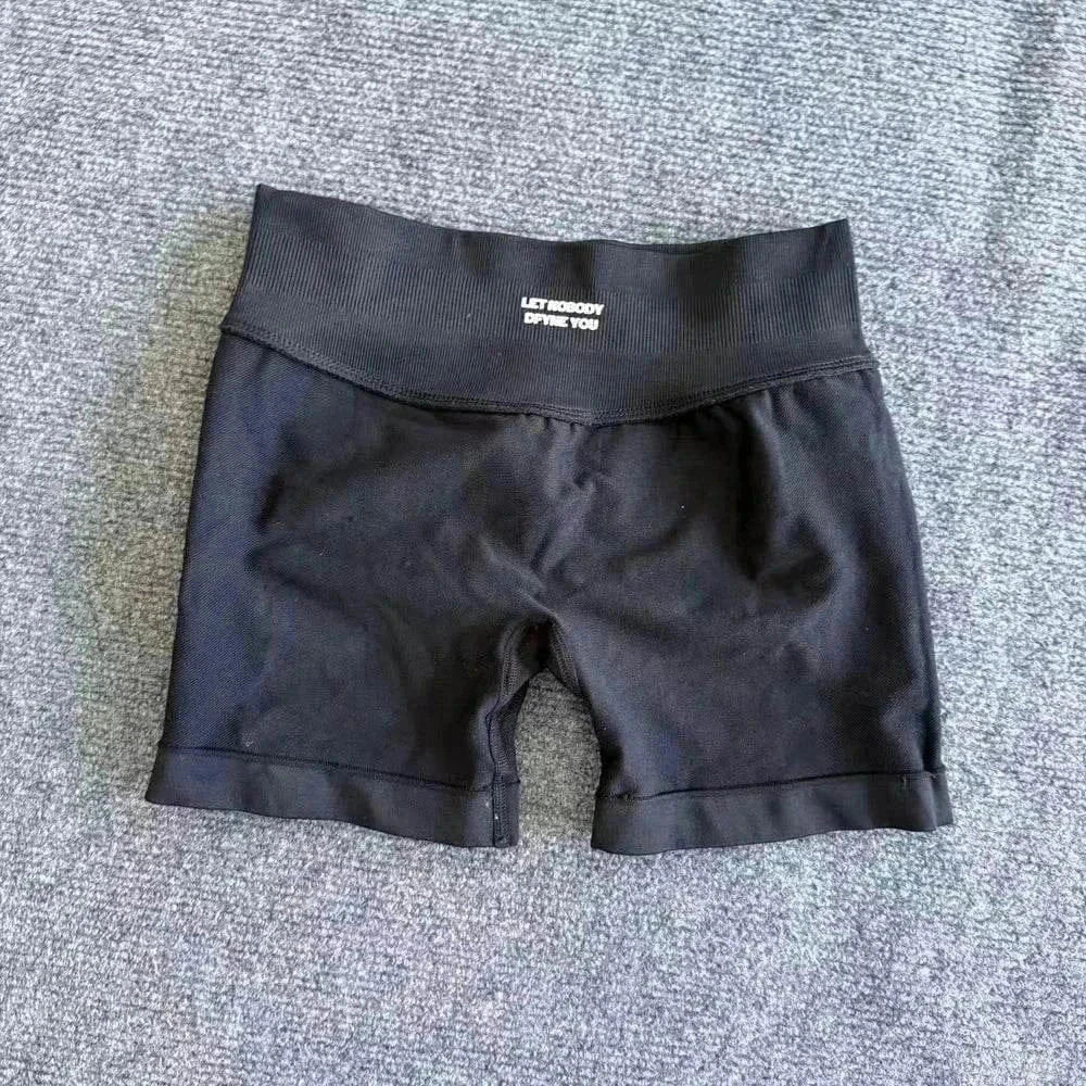 Women wearing seamless yoga shorts with scrunch bum design and logo for workout and fitness