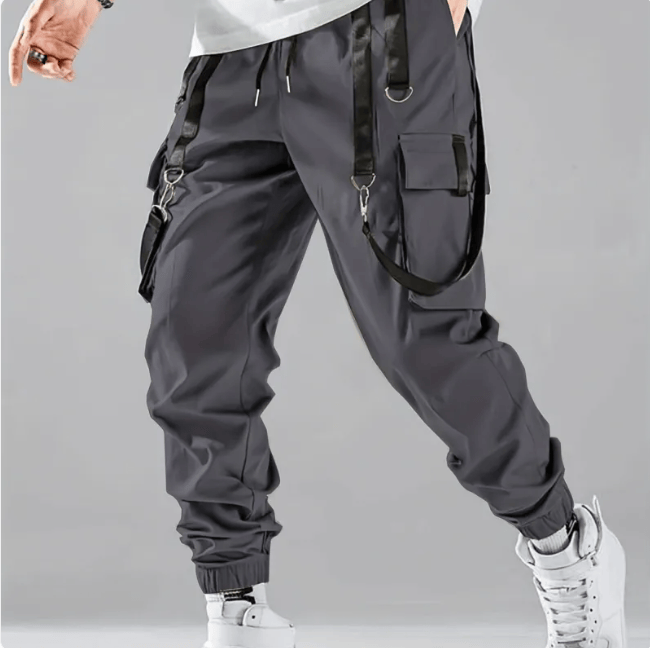 Multi-pocket techwear cargo pants in black with loose fit and durable polyester material