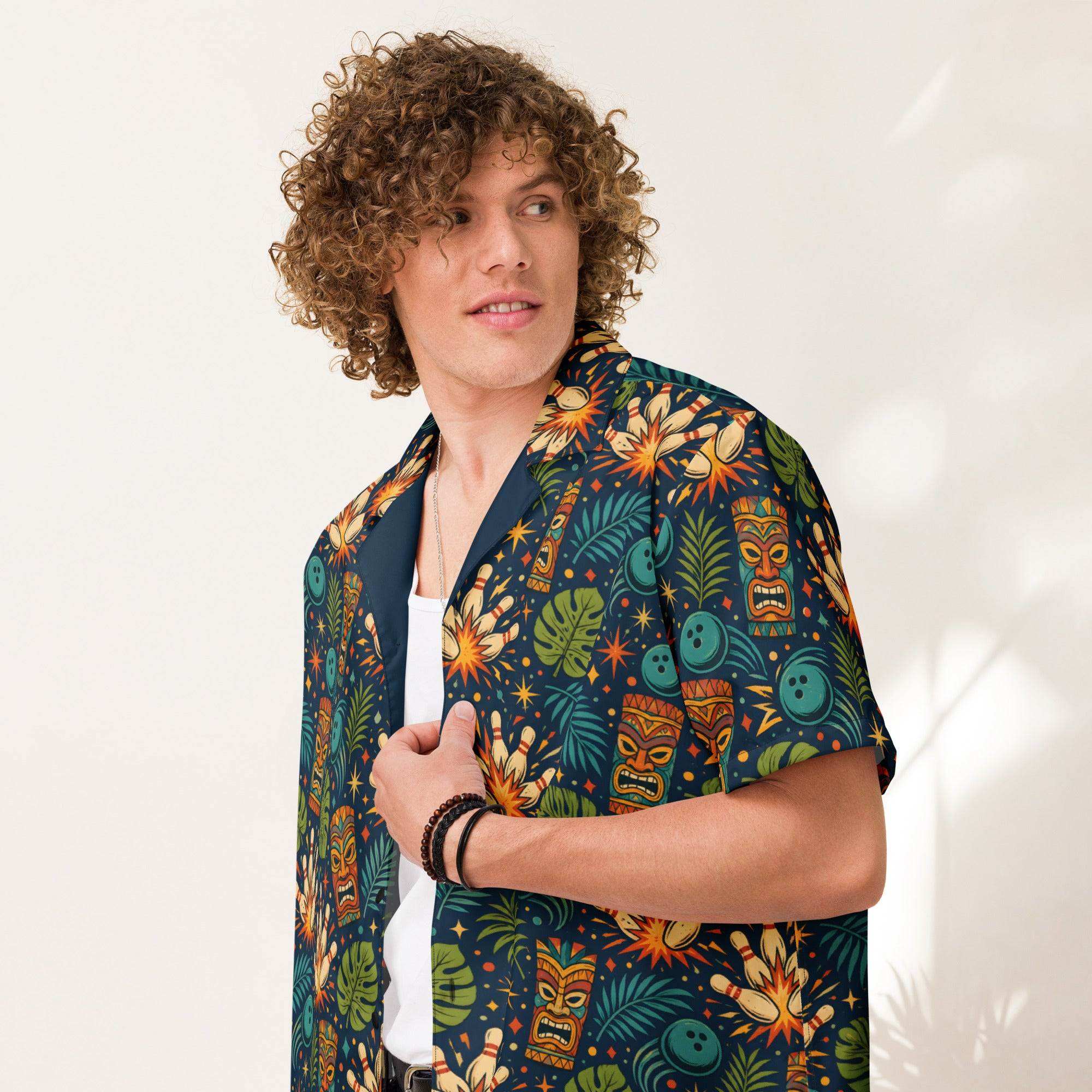 Navy tropical bowling Hawaiian shirt with tiki masks, bowling pins, and jungle leaves print, camp collar button-down design