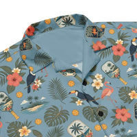 Dusty-blue Pickleball Hawaiian shirt with vintage paddles, flamingos, toucans, and tropical print in unisex UPF 50+ button-up style