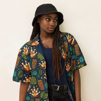 Navy tropical bowling Hawaiian shirt with tiki masks, bowling pins, and jungle leaves print, camp collar, and button-down front