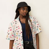 Unisex Espresso Martini Hawaiian shirt with coffee beans, cocktails, cherries, and palm tree print on cream fabric
