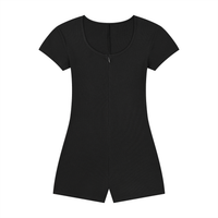 Woman wearing a ribbed tie-waist cape romper with a skinny X-line fit and scoop neckline in a casual Y2K athleisure style