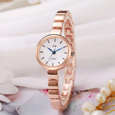 Women's niche steel watch with simple round white dial and rose gold alloy strap