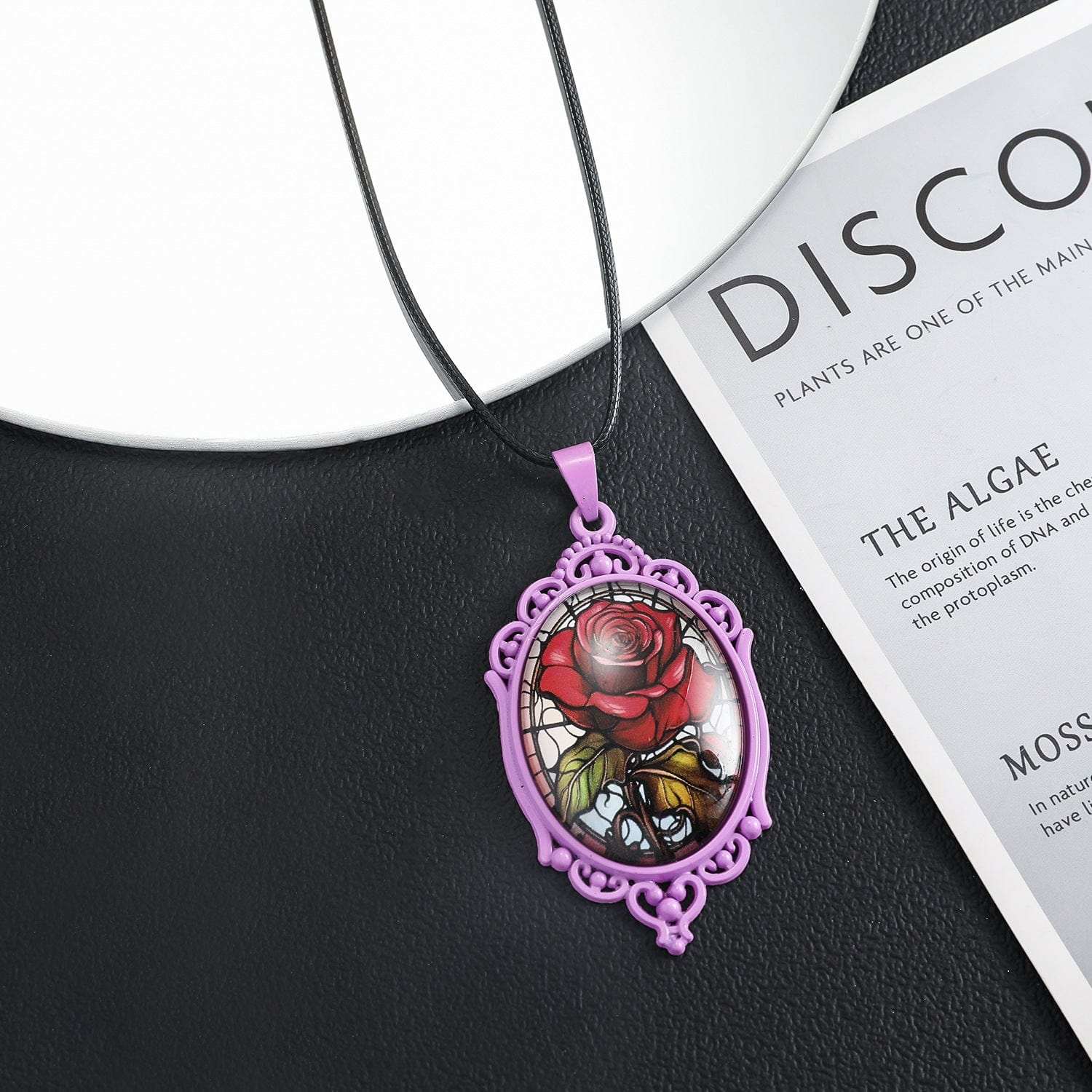 Elegant Gothic oval rose necklace in black, featuring a detailed flower pendant from TeninoVentures.