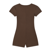 Woman wearing a fitted women's ribbed tie-waist cape romper with scoop neckline and short sleeves in a sporty Y2K athleisure style