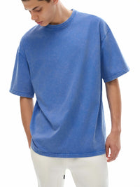 Snow washed oversized cotton t-shirt in black by ODMPOD, featuring a relaxed fit and casual style.
