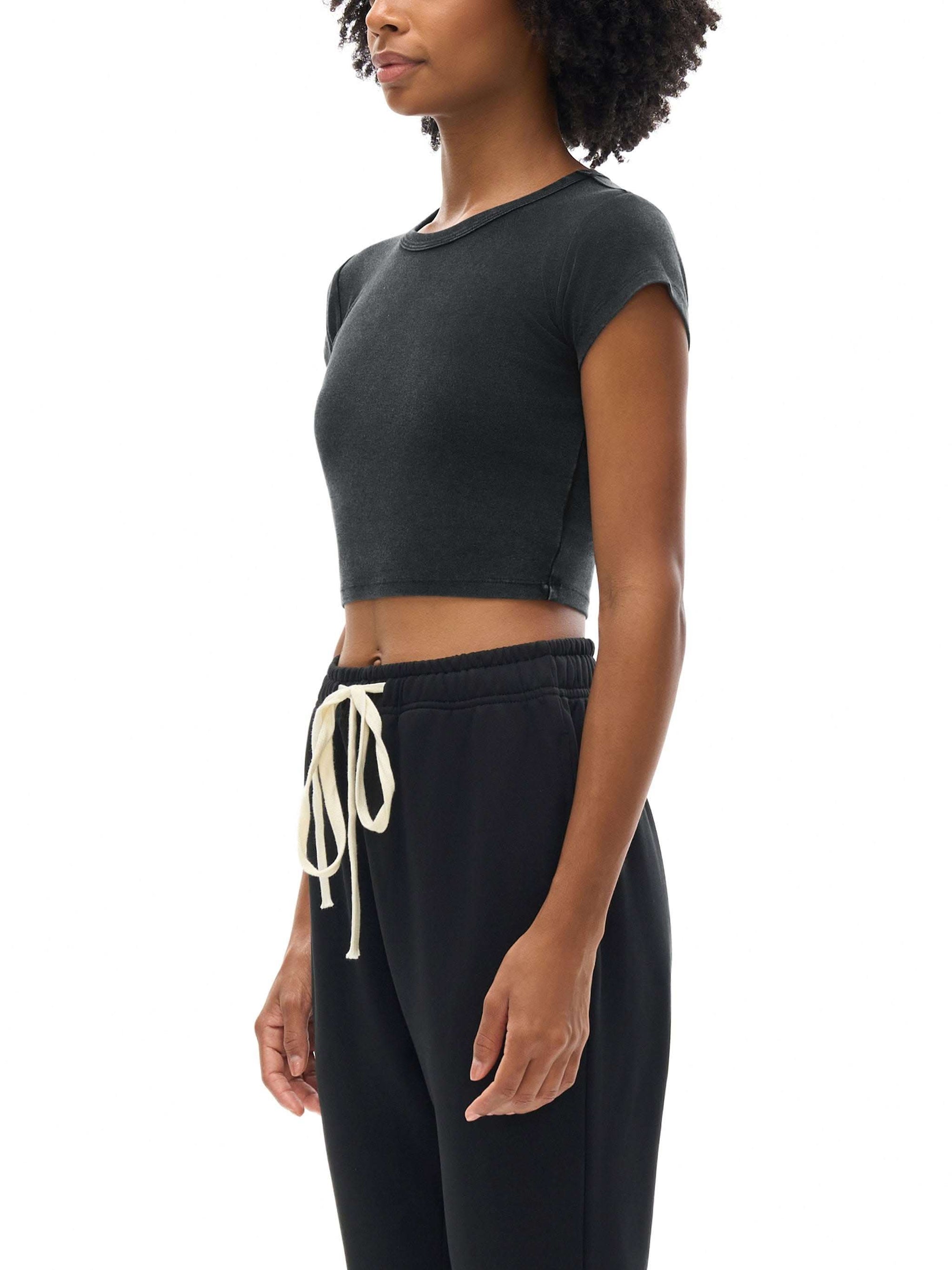 Women wearing vintage snow washed crop top with round neck and drop shoulder sleeves
