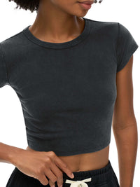 Women wearing vintage-style snow washed crop top with round neck and drop shoulder sleeves