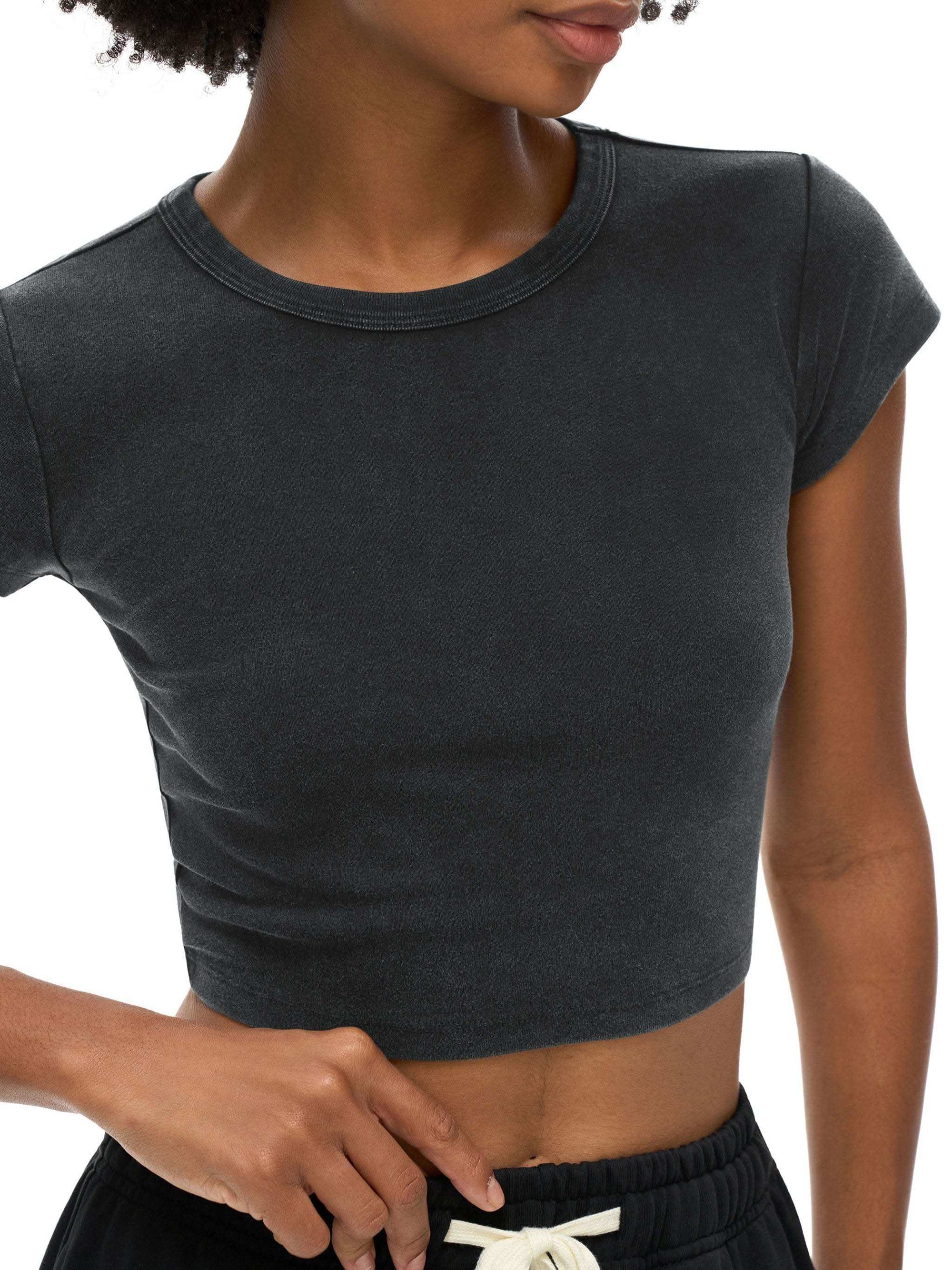 Women wearing vintage-style snow washed crop top with round neck and drop shoulder sleeves