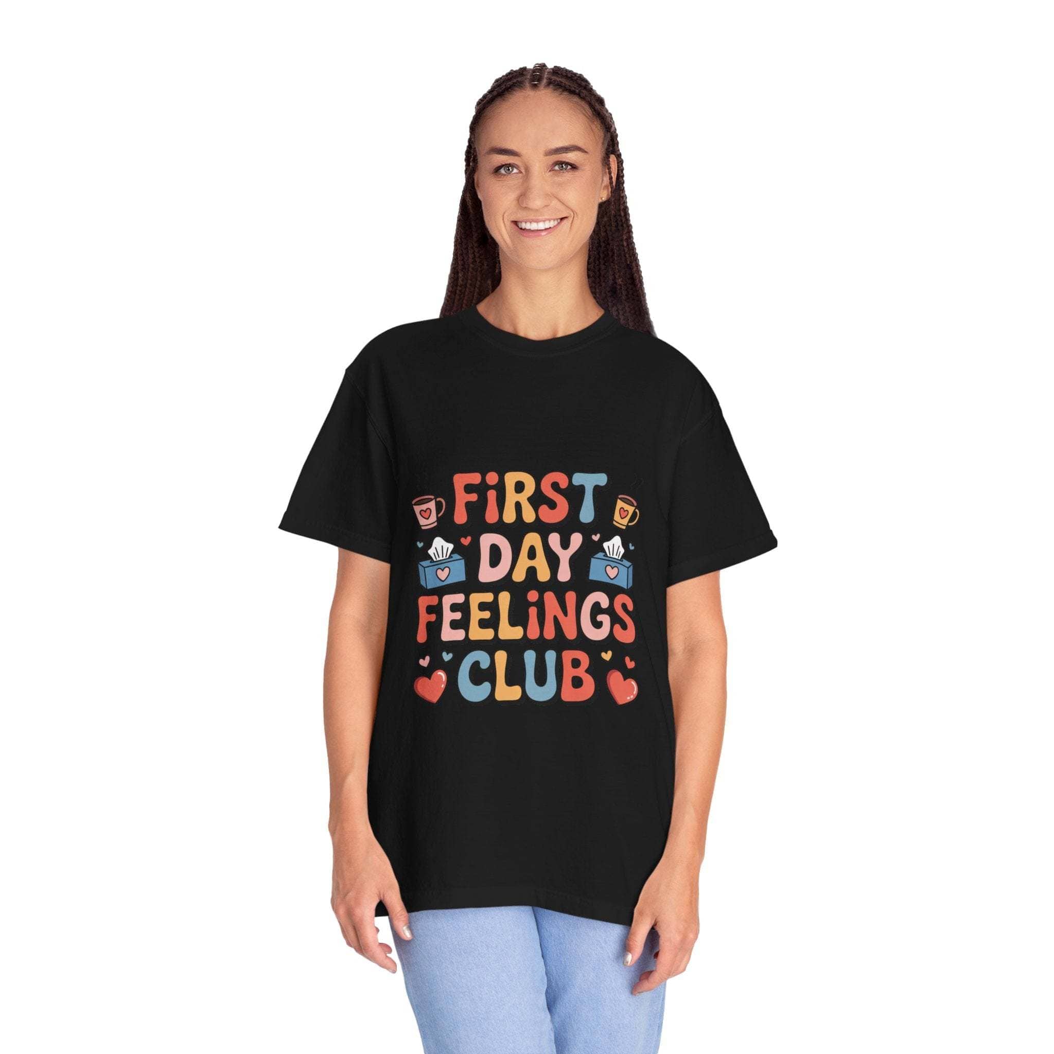 Woman wearing black First Day Feelings Club t-shirt with colorful text and icons, casual back to school style