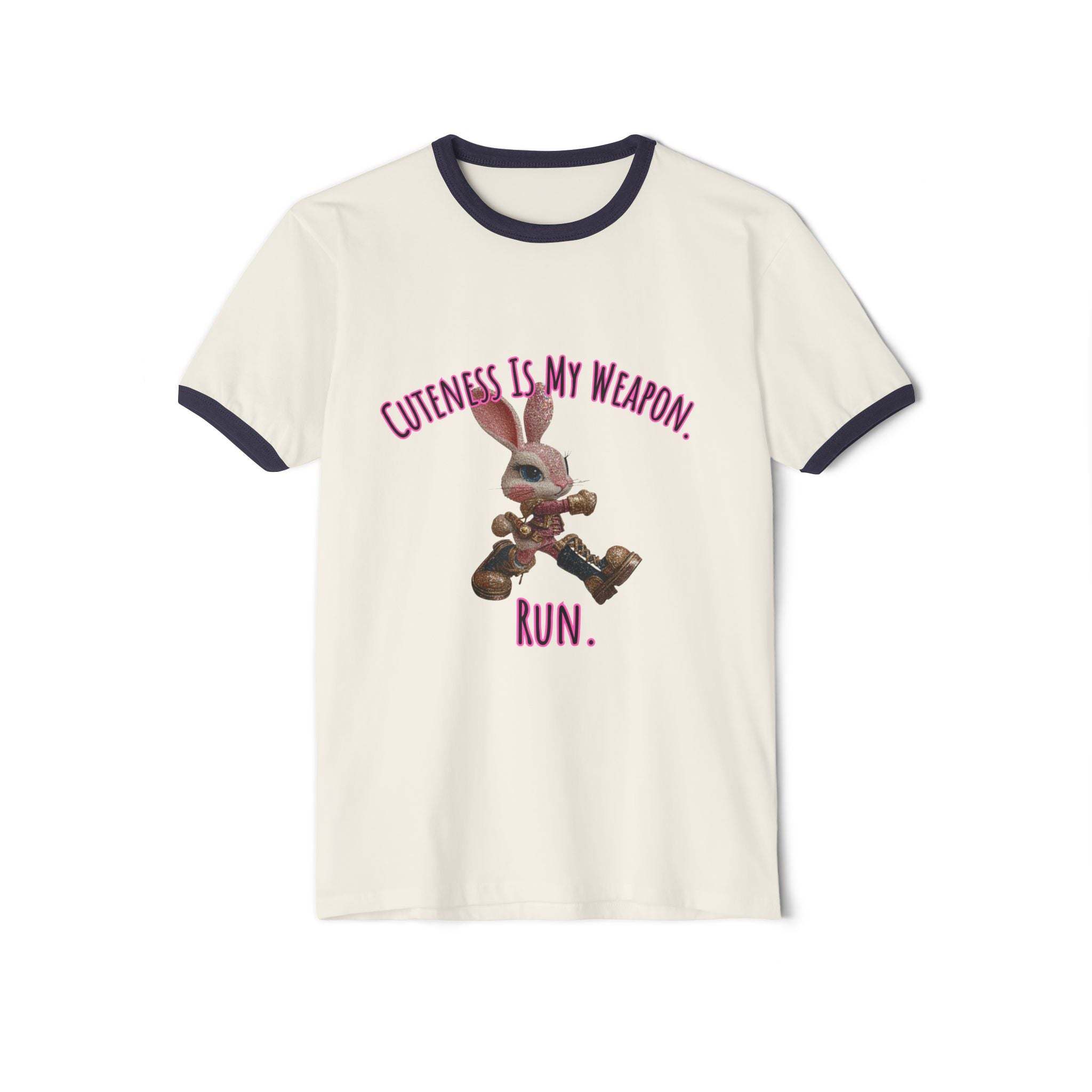 White ringer T-shirt with black collar and sleeves featuring a running bunny and text "Cuteness Is My Weapon. Run."