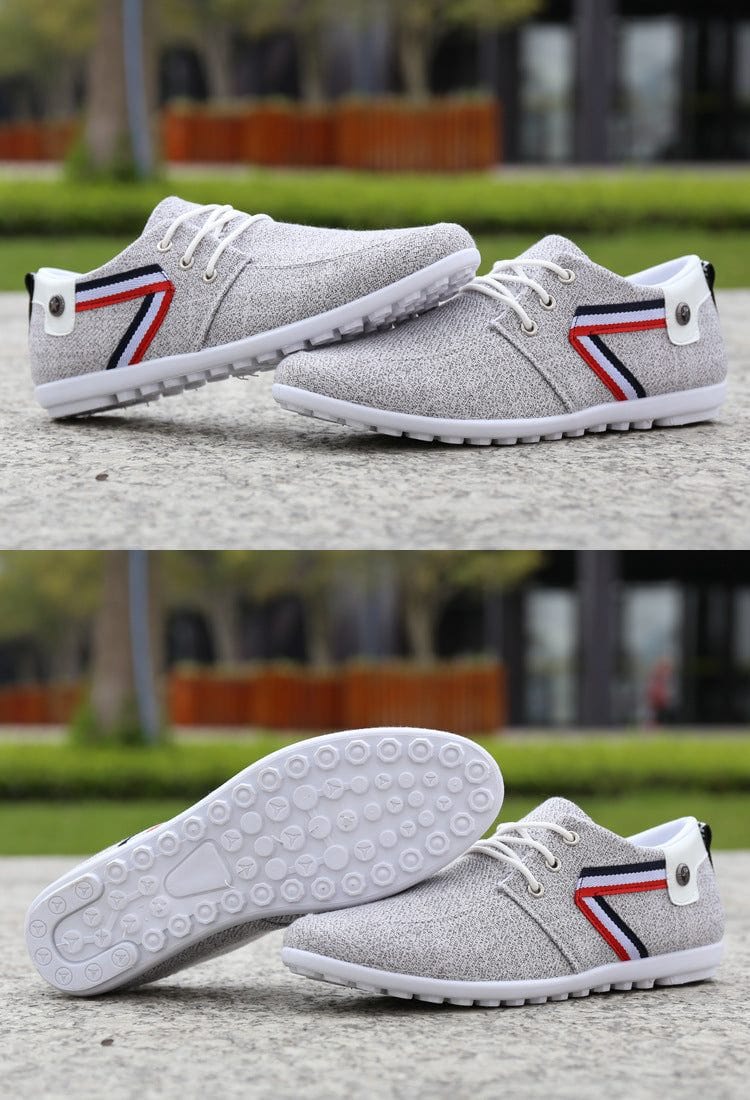 Men's soft-soled gray canvas shoes with round toe and red, white, and blue striped stitching design for casual sports and leisure.