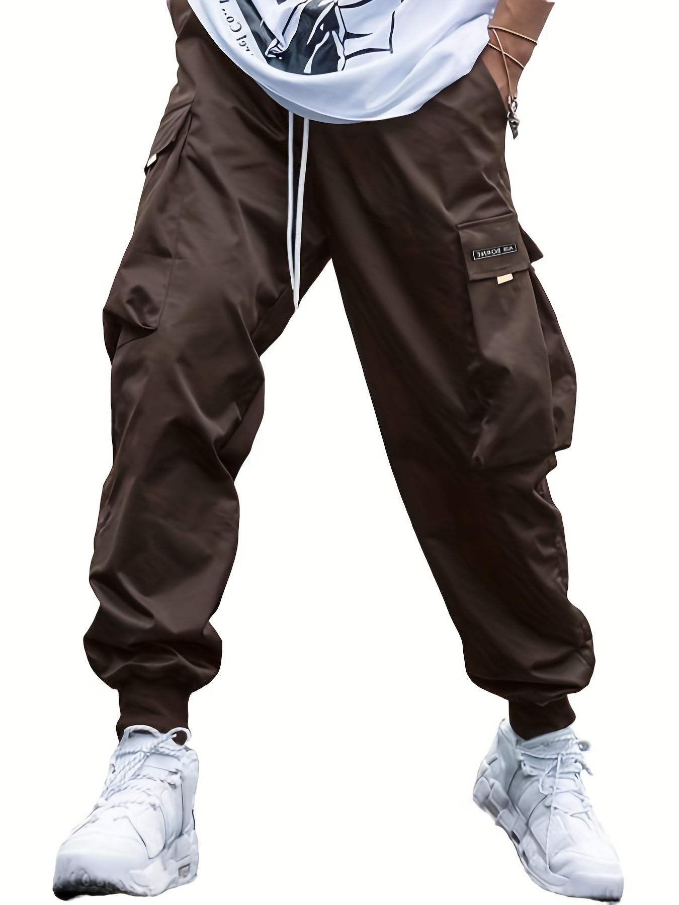 Men's casual hip-hop style multi-pocket cargo pants with drawstring waist and loose fit in dark color.