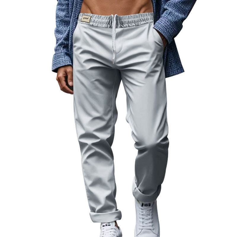 Men's casual loose fit light gray trousers with pockets and waist tie, quick-drying polyester fabric.